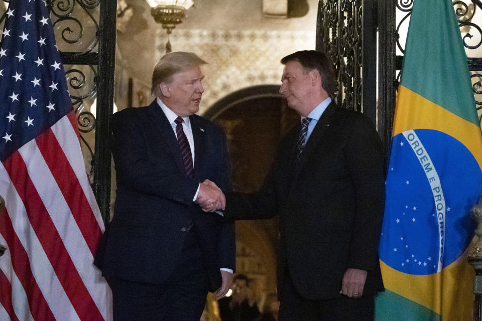 U.S. President Donald Trump and Brazilian President Jair Bolsonaro have presided over the world's two worst coronavirus outbreaks, and have each adopted increasingly authoritarian approaches to their countries amid the pandemic. (Photo: AP Photo/Alex Brandon, File)
