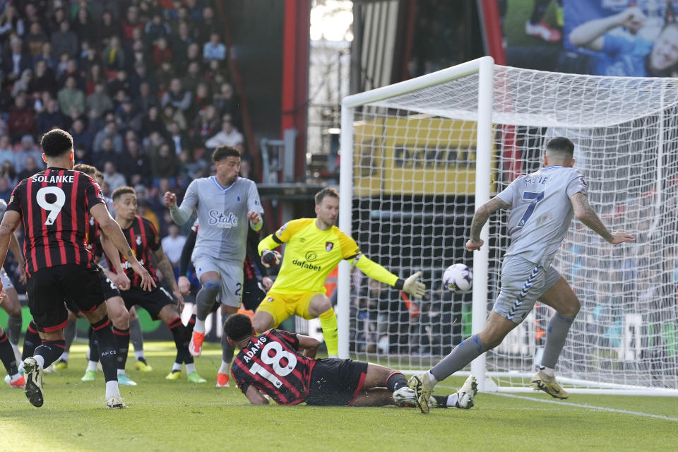 Everton's Dwight McNeil, right, shoots on target during the English Premier League soccer match between AFC Bournemouth vs Everton at the Vitality Stadium, Bournemouth, England, Saturday, March 30, 2024. (Andrew Matthews/PA via AP)