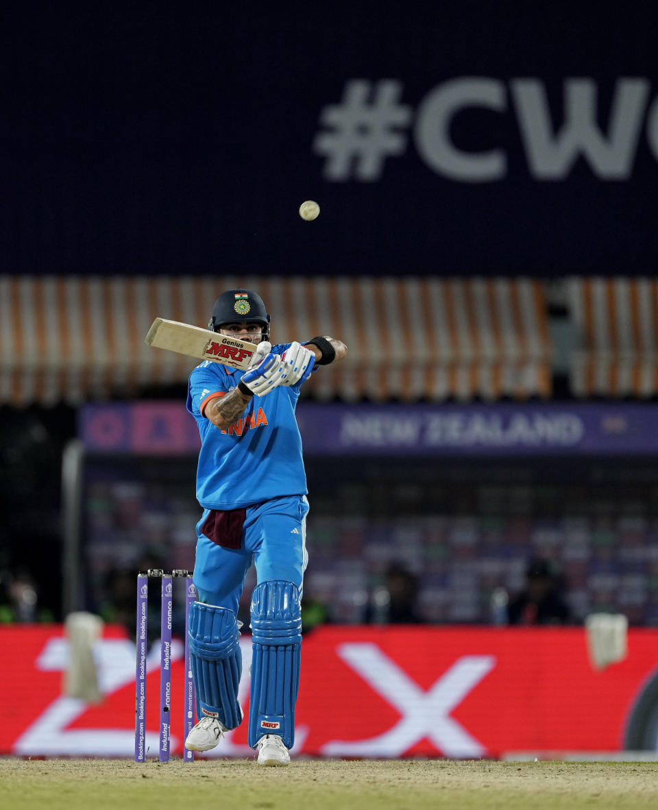 India's Virat Kohli plays a shot during the ICC Men's Cricket World Cup match between India and New Zealand in Dharamshala, India, Sunday, Oct. 22, 2023. (AP Photo/Manish Swarup)