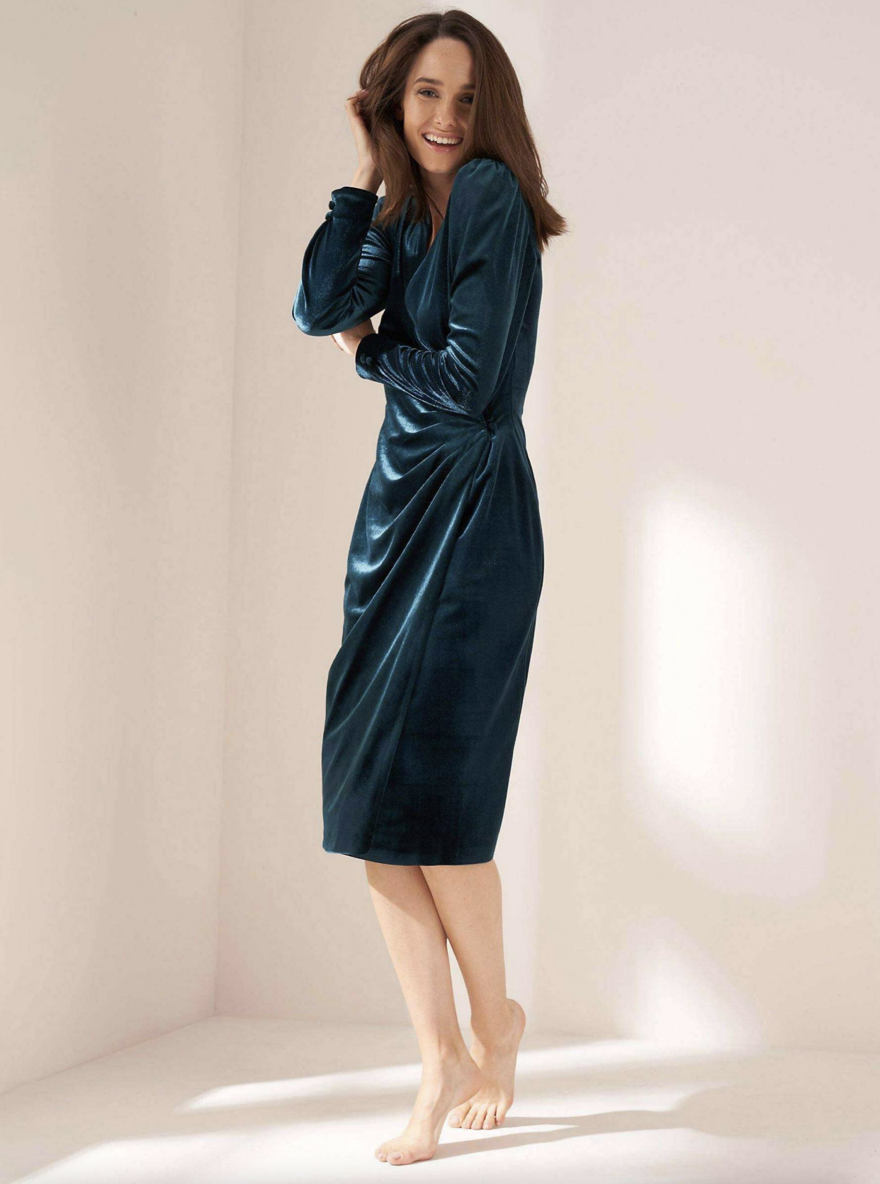 A velvet wrap dress that could be worn throughout winter. (John Lewis)