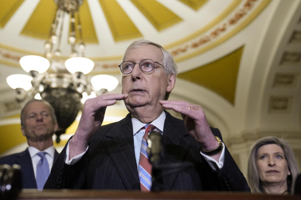 Senate Minority Leader Mitch McConnell, of Ky., center, Senator John Thune, R-SD,, left, and Senator Joni Ernst, R-Iowa, right, speak during a news conference with members of the Senate Republican leadership, Tuesday, Dec. 20, 2022, on Capitol Hill in Washington. (AP Photo/Mariam Zuhaib)