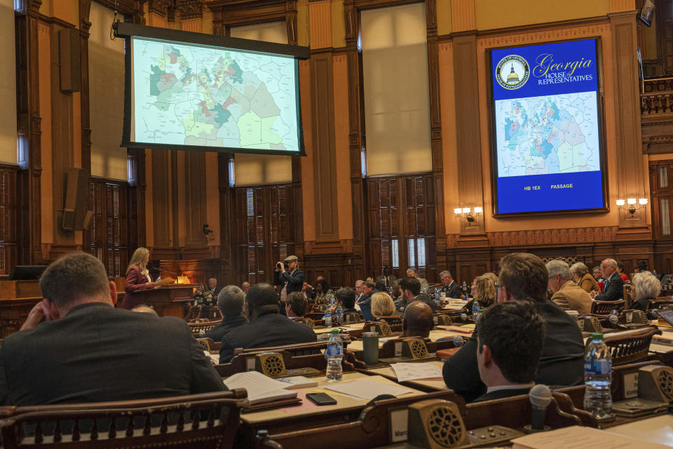 The Georgia House of Representatives votes on a new state House district map, Friday, Dec. 1, 2023, at the Georgia Capitol in Atlanta. Georgia lawmakers were ordered to redraw the state's legislative and congressional districts after a federal judge ruled some illegally diluted Black voting power. (Matthew Pearson/WABE via AP)