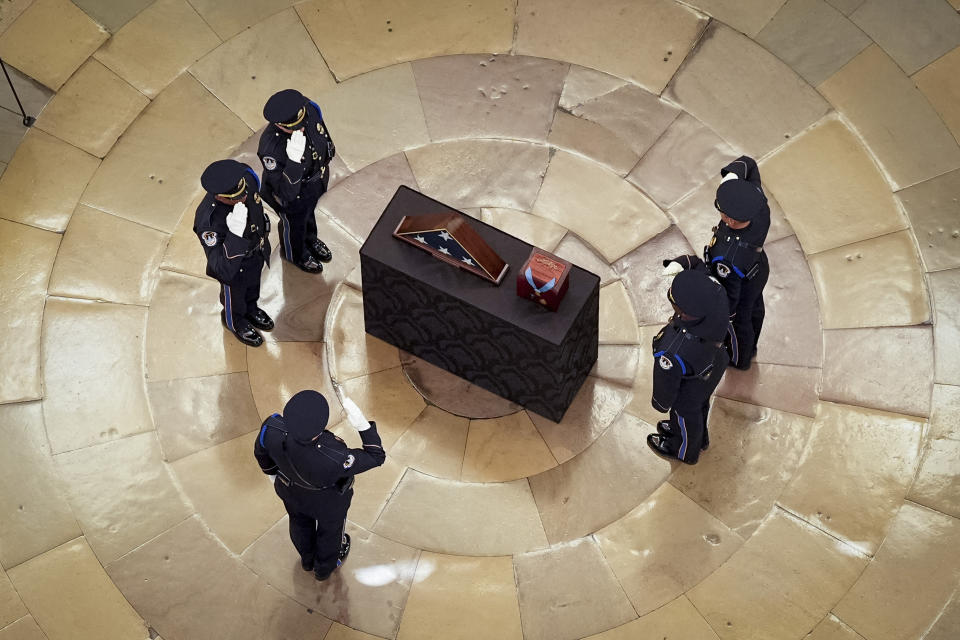 An honor guard salutes during a ceremony where the remains of retired Army Col. Ralph Puckett Jr., the last surviving Medal of Honor recipient for acts performed during the Korean War, lie in honor in the Rotunda at the Capitol in Washington, Monday, April 29, 2024. Puckett died on April 8 at his home in Columbus, Ga., at the age of 97. (Kevin Dietsch, Pool Photo via AP)