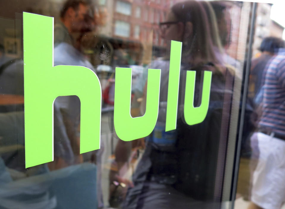 FILE - This June 27, 2015, file photo, shows the Hulu logo on a window at the Milk Studios space in New York. To get a full slate of programming, TV watchers may soon have to subscribe to several services instead of just one or two. Among those options will be services like Netflix and Hulu that offer a wide range of video from a variety of sources; cable-like 