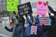 People gather in support of Sen. Mitt Romney, R-Utah, at the Wallace F. Bennett Federal Building in Salt Lake City, Utah, on Wednesday, Feb. 5, 2020. Republicans in the state are unusually divided on the president, so while some were heartened to see Romney cast what he described as an agonizing vote dictated by his conscience, Trump supporters were left angry and frustrated. (Francisco Kjolseth/The Salt Lake Tribune via AP)