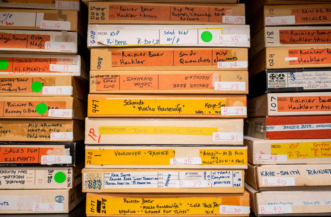 Iconic Rainier beer television commercials from the 1970’s and 1980’s lie on shelves in filmmaker and director, Isaac Olsen’s, studio in Tacoma, Wash. on Sept. 20, 2022. The Washington State Historical Society lent Olsen the original film from the making of the commercials.