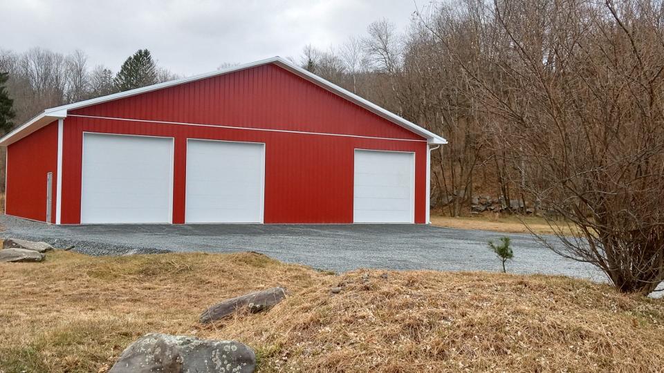 Michael Kuzmiak Jr. purchased the former Lake Region EMS property at 15 Old Gravity Road in August 2023. Kuzmiak has since completed constructing the exterior walls and doors of the former ambulance office/garage, which was left as only a wood frame with a metal roof when the ambulance company dissolved June 1. The construction trailer that the ambulance company had been temporarily using has also been removed.