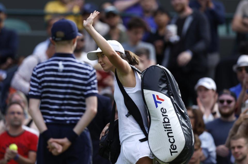 Iga Swiatek waves goodbye after her first defeat since February (Steven Paston/PA) (PA Wire)