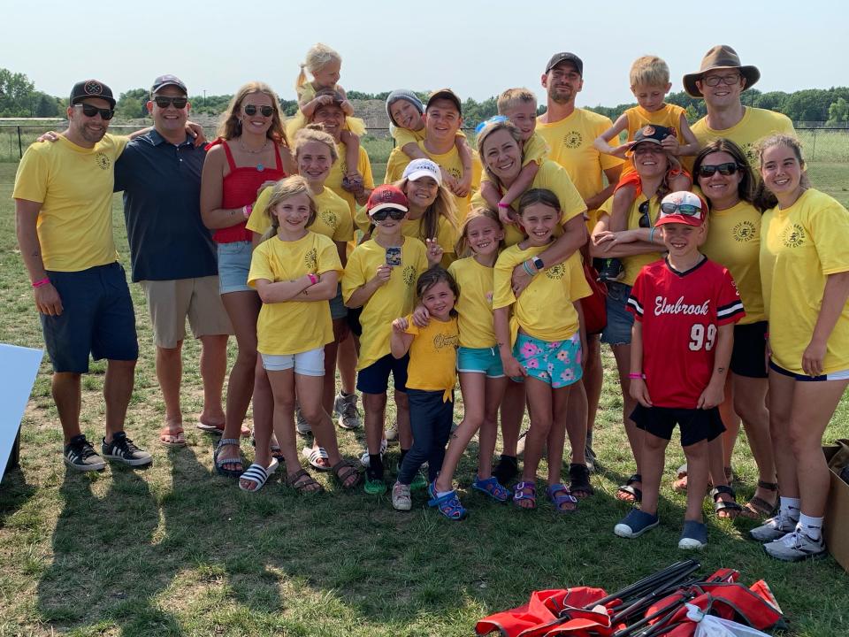 Little Warrior Foundation volunteers attend a Milwaukee Milkmen charity baseball game.