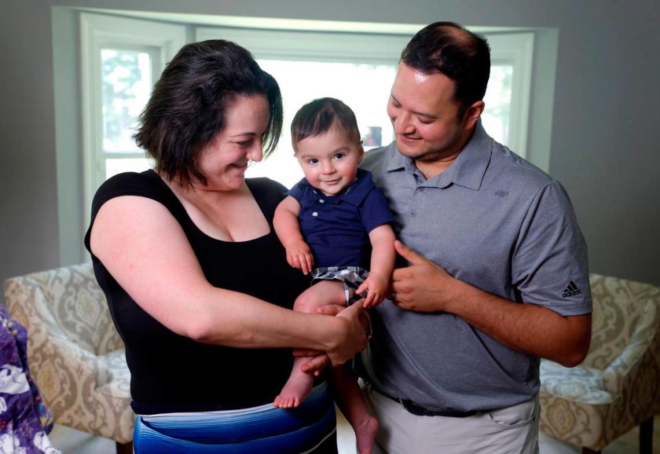 Stefanie Wisda, at ease in Cary in 2023 with her husband and young son, weathered a serious and unexpected life-threatening medical emergency the day Eli was born.