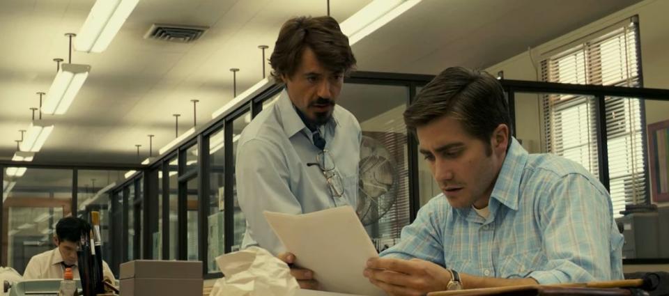 Robert and Paul looking at paper in "Zodiac"