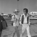 <p>Actress Ali MacGraw and husband Robert Evans cross the tarmac at a Rome airport as they depart for Nice, France in 1971.</p>