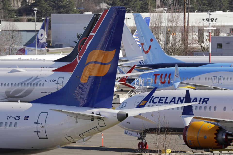 Grounded Boeing 737 MAX airplanes fill a parking area adjacent to Boeing Field, Wednesday, Feb. 19, 2020, in Seattle. Washington state lawmakers say they will introduce bills, at The Boeing Co.'s request, to suspend the aerospace giant's preferential business and occupation tax rate until the United States and European Union resolve their long-running international trade dispute. (AP Photo/Elaine Thompson)