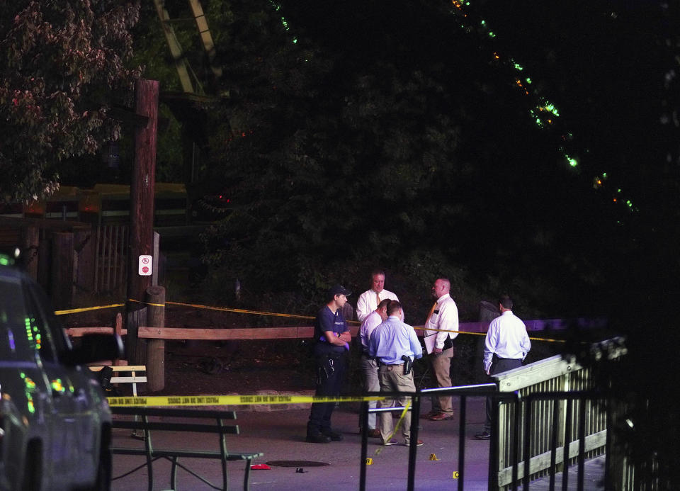 Police and other emergency personnel from multiple jurisdictions converged on Kennywood Park late Saturday night Sept. 24, 2022, in West Mifflin, Pa., for reports of shots fired inside the sprawling amusement park. Several people, including two teenagers, were wounded by gunfire late Saturday at an amusement park southeast of Pittsburgh, which was kicking off a Halloween-themed festival. (Nate Guidry/Pittsburgh Post-Gazette via AP)