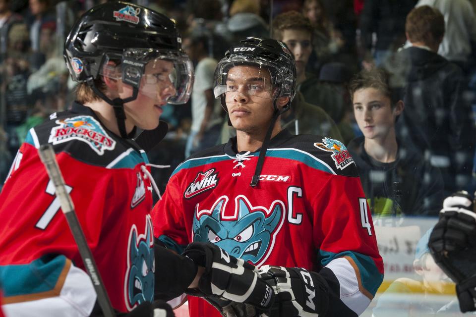 KELOWNA, CANADA - NOVEMBER 7: Madison Bowey #4 of Kelowna Rockets congratulates teammates on the win against the Spokane Chiefs as they exit the ice for the dressing room on November 7, 2014 at Prospera Place in Kelowna, British Columbia, Canada. (Photo by Marissa Baecker/Getty Images)