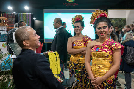 People visit an exhibition of Indonesia inside the venue of the COP24 U.N. Climate Change Conference 2018 in Katowice, Poland, December 6, 2018