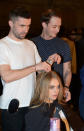 Cara Delevingne gets her locks tended to before the Topshop show © Rex