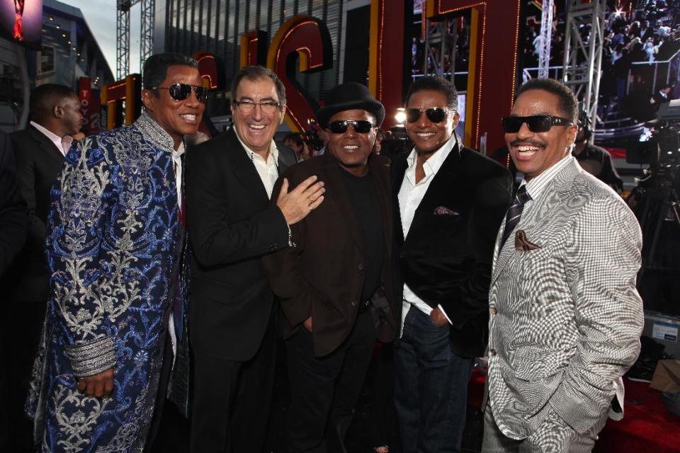 This Oct. 27, 2009 file photo shows Jermaine Jackson, Director/Producer Kenny Ortega, Tito Jackson, Jackie Jackson and Marlon Jackson at Columbia Pictures' Premiere of Michael Jackson's "This Is It" at the Nokia Theatre L.A. Live, in Los Angeles. Jurors hearing a case filed by Katherine Jackson over her son Michael’s death have received a behind-the-scenes look at the superstar’s troubles off-camera as he prepared for his ill-fated comeback shows. The panel was reminded on Thursday, Aug. 8, 2013, of statements describing the “Thriller" singer as deteriorating and slow to pick up material for the shows that would heavily feature the hits that made him famous, but defense attorneys for concert promoter AEG Live LLC say the “This Is It” footage is an accurate portrayal of his preparations and doesn’t show Jackson in decline. (Photo by Eric Charbonneau/Invision/AP Images, File)
