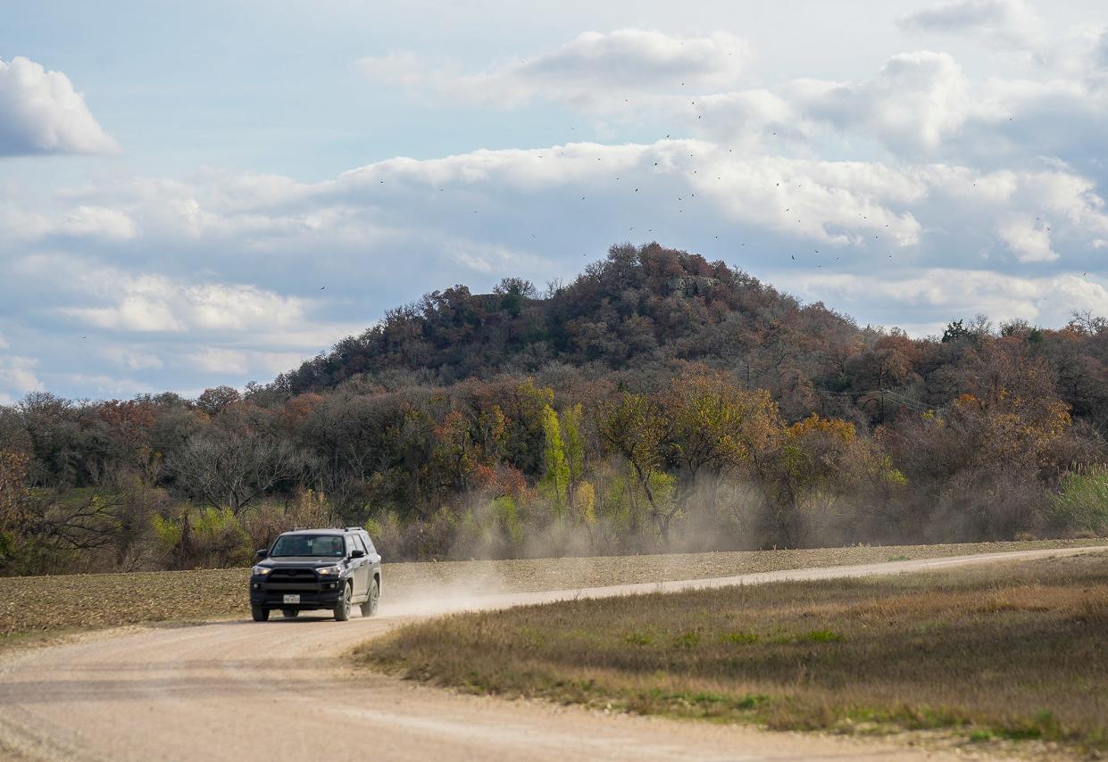 Sugarloaf Mountain, or Red Mountain, a tall conical hill of red sandstone, is sacred to the Tonkawa. Because of the trees, it's hard to see at its base, but head out across the Little River to the fields beyond, and it's unmistakable.