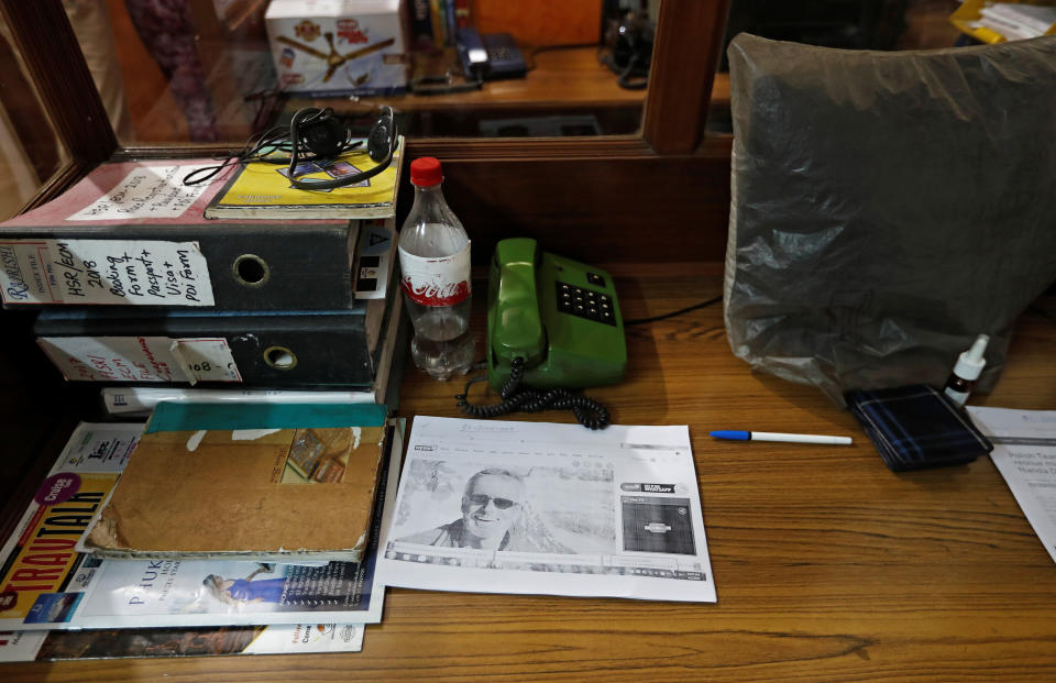 A picture of missing British climber Martin Moran is seen inside the office where the search is being co-ordinated (Picture: Reuters)