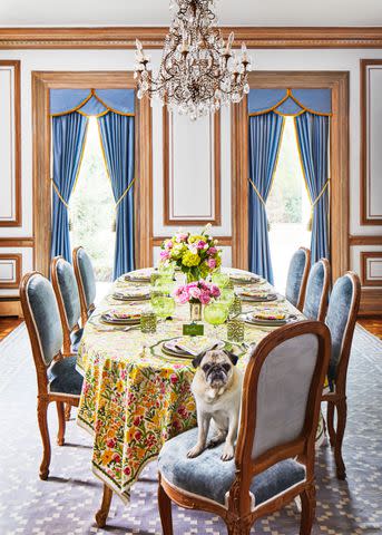 <p>Laurey W. Glenn</p> Beckâ€™s cute pug, Penelope, holds court at the table, which is dressed in the brandâ€™s 70s Flower linens. This is a lively nod to the Kentucky Derbyâ€™s long-standing floral tradition, which includes presenting the winning horse with an enormous rose garland.