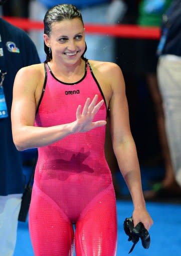 Rebecca Soni waves to the crowd after swimming to a first place finish in the women's 200m breaststroke final at the US Olympic Team Trials on June 30. Soni won the event in 2:21.13, improving on her own world-leading time of the season