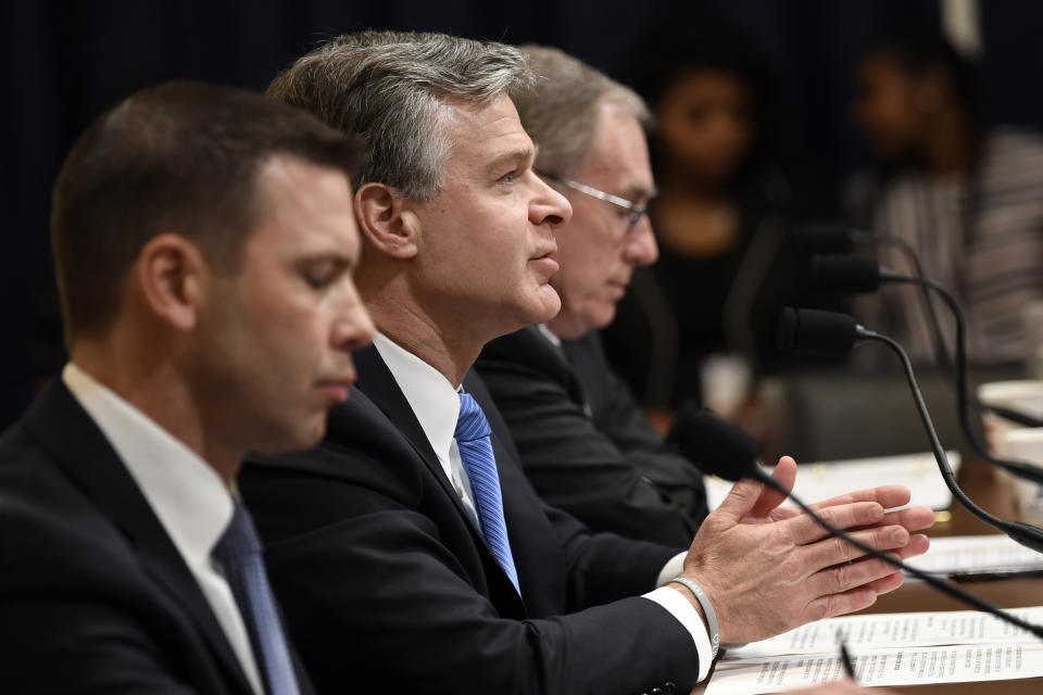 FBI Director Christopher Wray, flanked by Acting Homeland Security Secretary Kevin McAleenan, left, and acting Director of the National Counterterrorism Center at the office of the Director of National Intelligence Russell Travers, right, testifies before the House Homeland Security Committee on Capitol Hill in Washington, Wednesday, Oct. 30, 2019, during a hearing on domestic terrorism. (AP Photo/Susan Walsh)