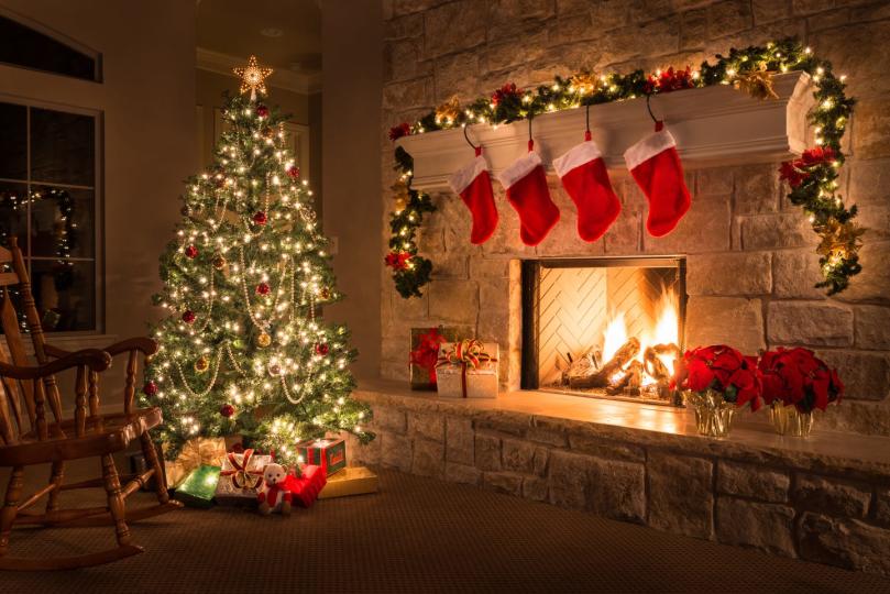 christmas glowing fireplace, hearth, tree red stockings gifts and decorations