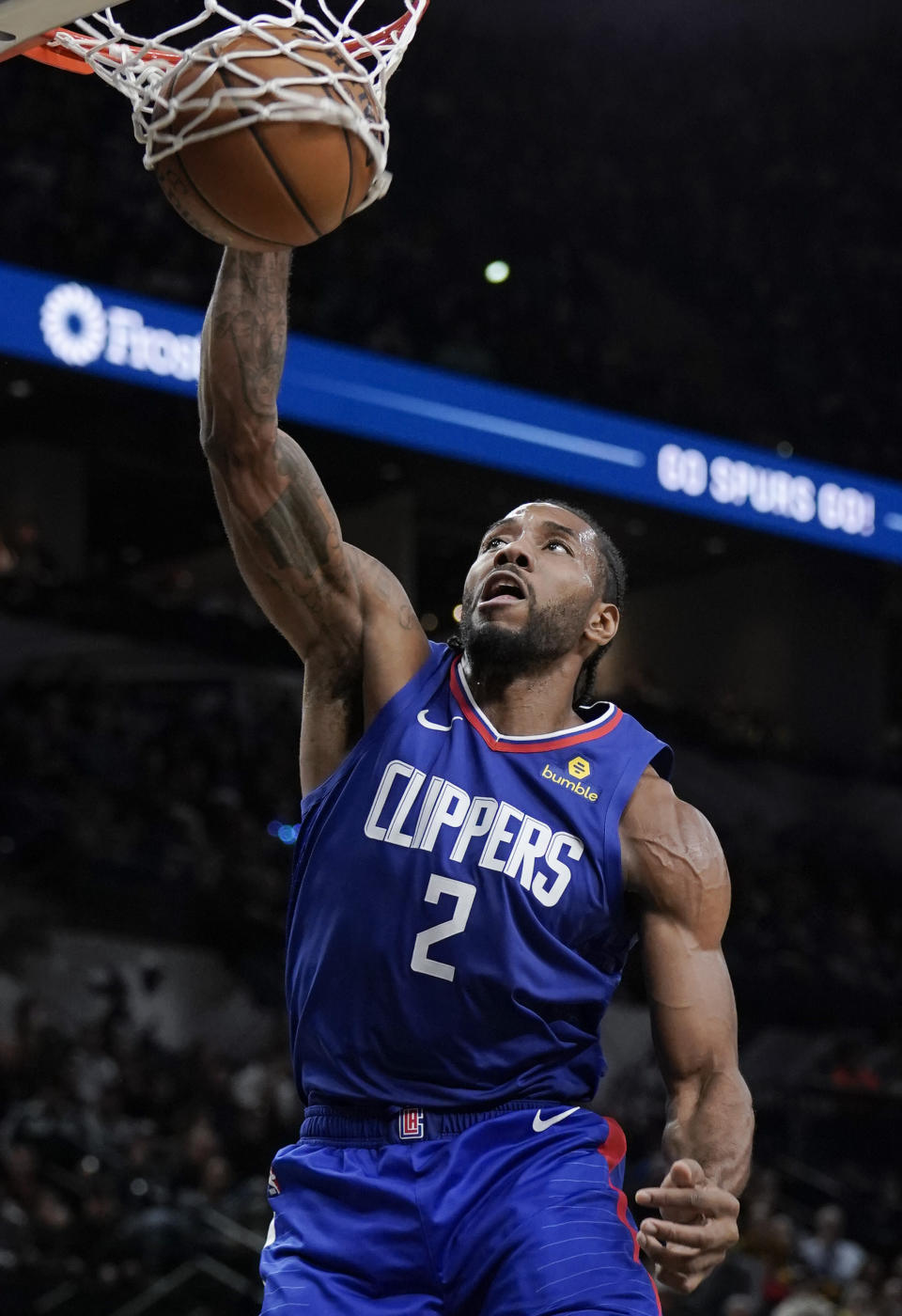 Los Angeles Clippers' Kawhi Leonard dunks during the first half of an NBA basketball game against the San Antonio Spurs, Saturday, Dec. 21, 2019, in San Antonio. (AP Photo/Darren Abate)