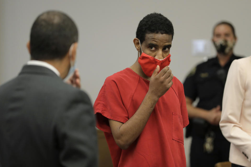 FILE - Dawit Kelete, looks toward his attorney, Francisco Duarte, left, as he appears in King County Superior Court, Wednesday, July 22, 2020, in Seattle, for his arraignment on felony charges of vehicular homicide, vehicular assault and reckless driving. Kelete, who hit two protesters, killing one of them, with his car during a Black Lives Matter demonstration in Seattle in 2020 has pleaded guilty to multiple felonies. The Seattle Times reports 30-year-old Kelete pleaded guilty on Thursday, July 27, 2023, to vehicular homicide in the death of Summer Taylor. (AP Photo/Ted S. Warren, File)