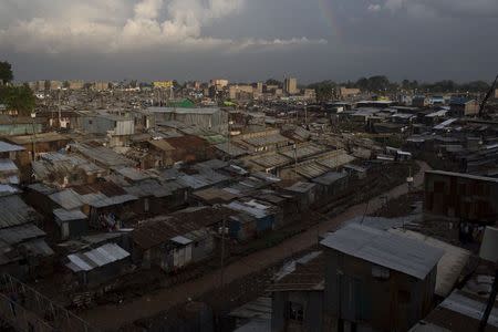 A rainbow appears above Mathare in Nairobi, Kenya, November 17, 2015. Around 2 million people live in the shantytowns packed in around Kenya's capital. Crime is high amid chronic unemployment levels, while basic services and sanitation are scarce. Residents try to make the best of things, eking out a living and picking up work where they can. REUTERS/Siegfried Modola