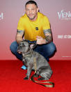 <p>Tom Hardy and his dog Blue attend the fan screening of <em>Venom: Let There Be Carnage</em> at Cineworld Leicester Square on Sept. 14 in London.</p>