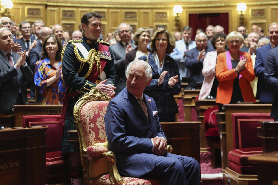 French lawmakers from both the upper and the lower house of parliament applaud Britain's King Charles III before his address at the French Senate, Thursday, Sept. 21, 2023 in Paris. King Charles III will later meet with sports groups in the northern suburbs of Paris and pay a visit to fire-damaged Notre-Dame cathedral Thursday, on the second day of his state visit to France.( Emmanuel Dunand, Pool via AP)