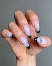 For something witchy yet minimalist, try a black-and-white celestial French mani.