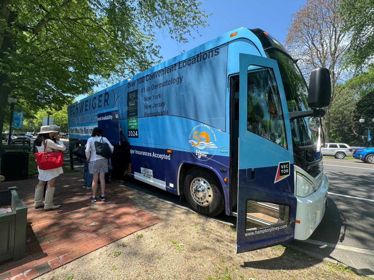 people getting their luggage from underneath the hamptons jitney bus