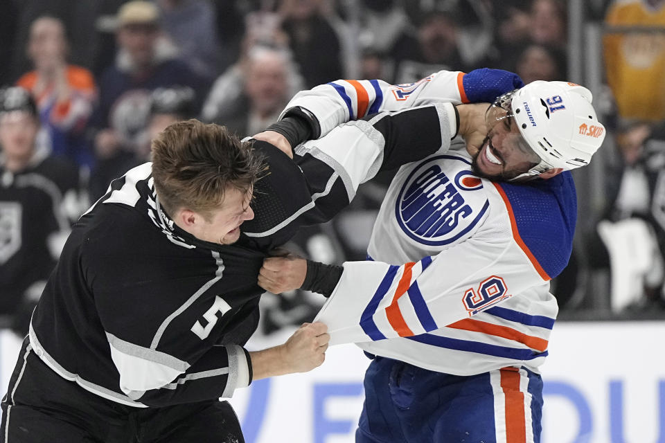 Los Angeles Kings defenseman Andreas Englund, left, and Edmonton Oilers left wing Evander Kane fight during the third period in Game 3 of an NHL hockey Stanley Cup first-round playoff series Friday, April 26, 2024, in Los Angeles. (AP Photo/Mark J. Terrill)
