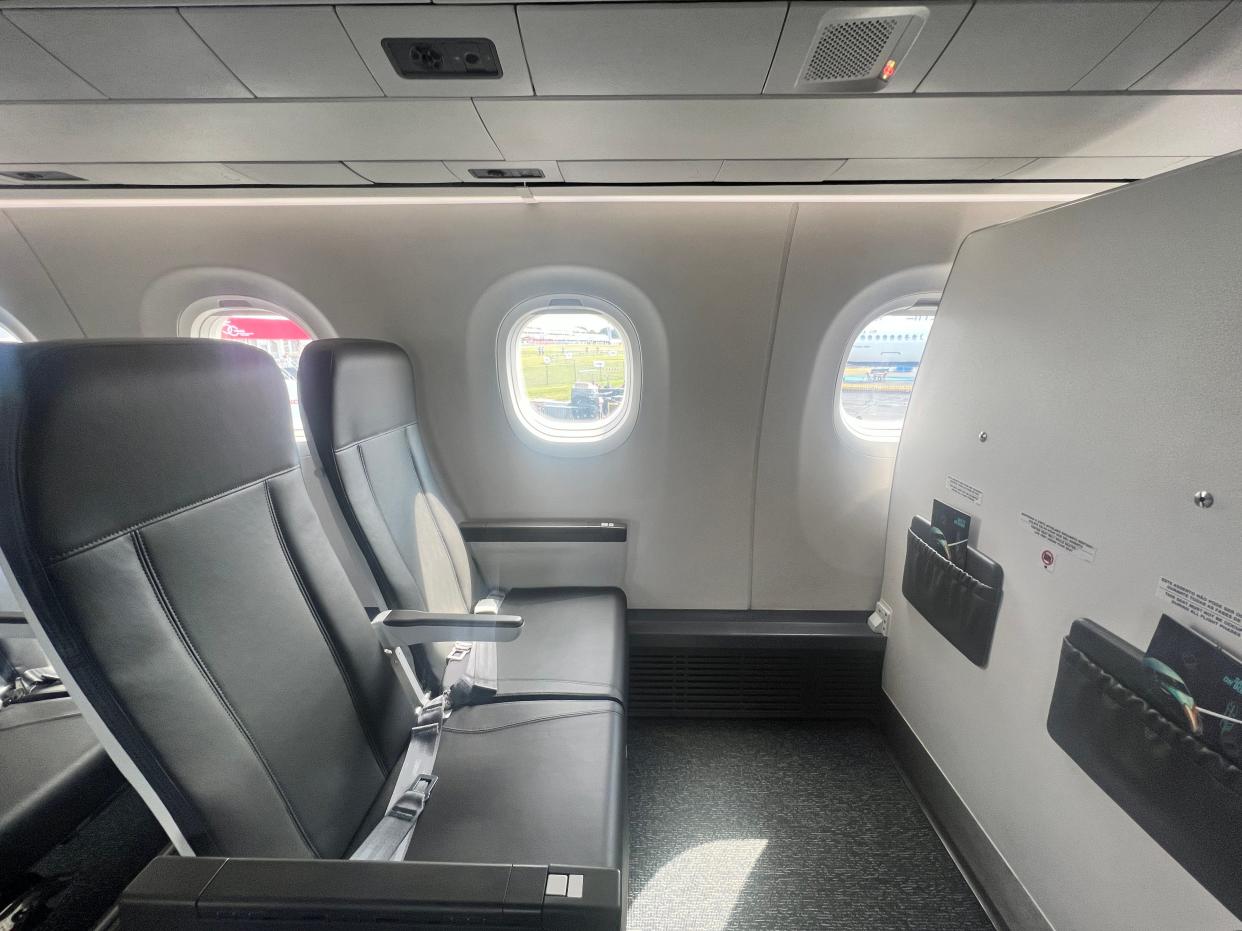 A row of two premium seats on an Embraer E195-E2 at the 2024 Farnborough Airshow