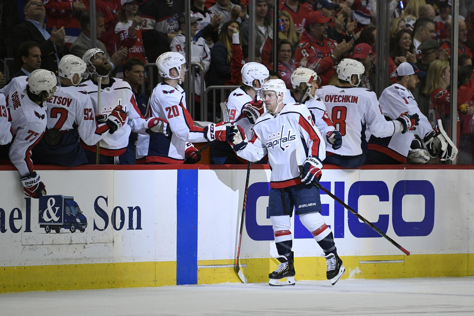 Washington Capitals center Travis Boyd (72) celebrates his goal with the bench during the second period of an NHL hockey game against the Philadelphia Flyers, Sunday, March 24, 2019, in Washington. (AP Photo/Nick Wass)