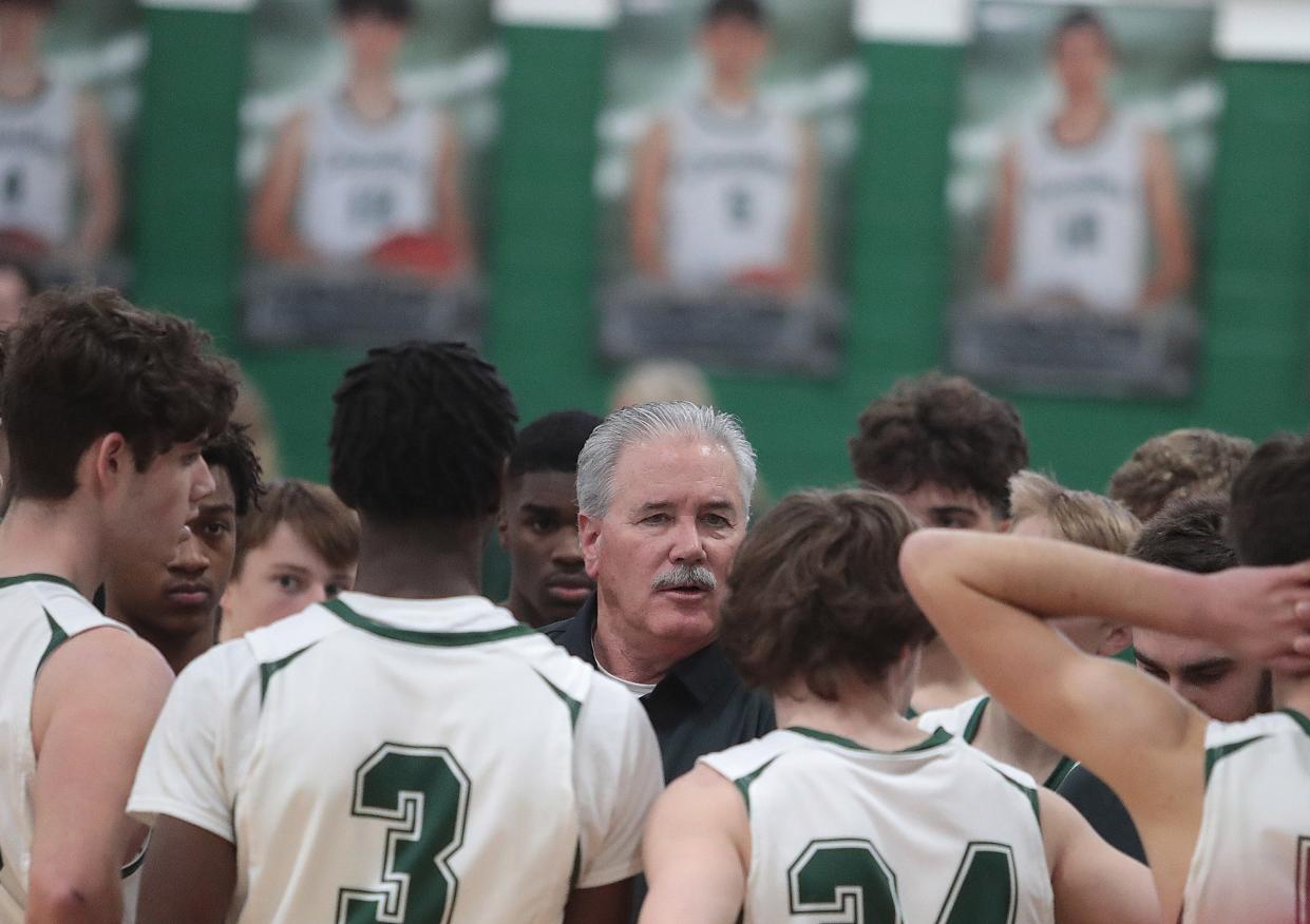 Central Catholic head boys basketball coach Matt Creamer, talking with his team before a home game a year ago, guided the Crusaders to two wins within 12 hours this weekend.