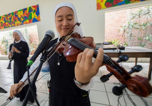 Sister Arisa, a violinist from Japan, says that "it was God's plan" that she and other nuns form a band