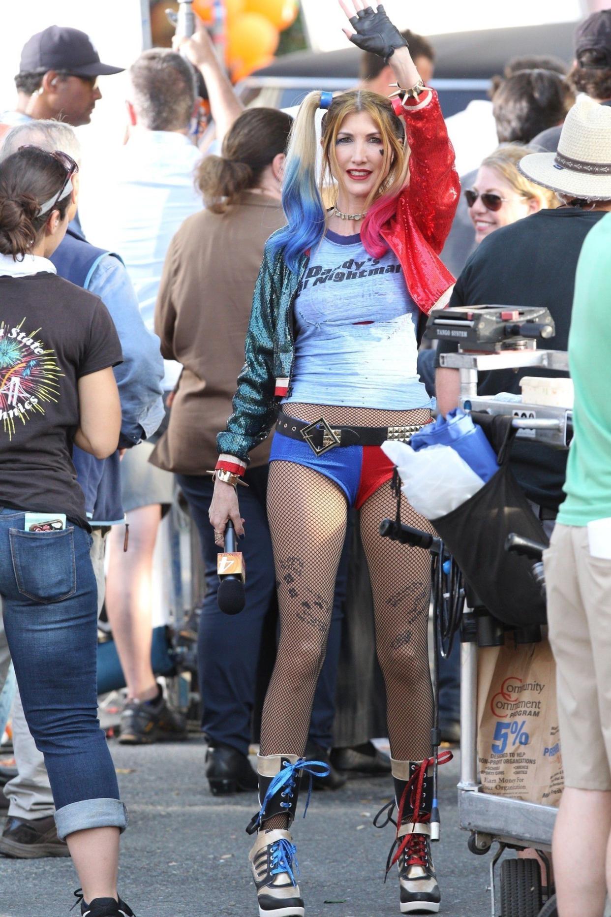 Jackie Sandler waves to onlookers dressed as Harley Quinn on the set of her husband Adam Sandler's upcoming film "Hubie Halloween," in Marblehead, MA on July 15, 2019.