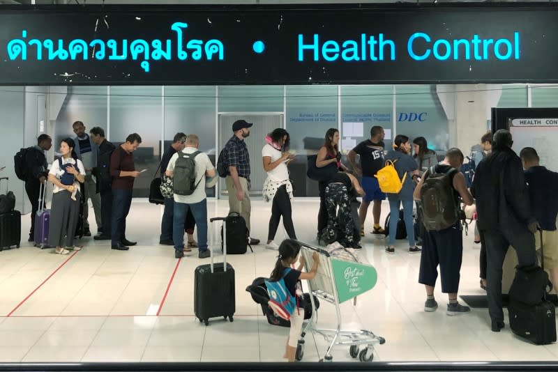 Tourist line-up in a health control at the arrival section at Suvarnabhumi international airport in Bangkok, Thailand