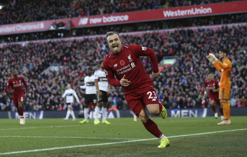 Liverpool's Xherdan Shaqiri celebrates scoring his side's second goal of the game, during the English Premier League soccer match between Liverpool and Fulham, at Anfield Stadium, in Liverpool, England, Sunday, Nov. 11, 2018. (Barrington Coombs/PA via AP)