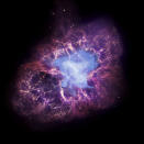 This composite image made available by NASA shows a neutron star, center, left behind by the explosion from the original star's death in the constellation Taurus, observed on Earth as the supernova of A.D. 1054. This image uses data from three of NASA's observatories: the Chandra X-ray image is shown in blue, the Hubble Space Telescope optical image is in red and yellow, and the Spitzer Space Telescope's infrared image is in purple. After nearly two decades in Earth orbit, scanning the universe with infrared eyes, ground controllers plan to put the faltering Spitzer Space Telescope into permanent hibernation on Thursday, Jan. 29, 2020. (X-Ray: NASA/CXC/J.Hester (ASU); Optical: NASA/ESA/J.Hester & A.Loll (ASU); Infrared: NASA/JPL-Caltech/R.Gehrz (Univ. Minn.) via AP)