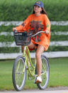 <p>Emily Ratajkowski enjoys another solo bike ride in The Hamptons, New York, on Friday.</p>