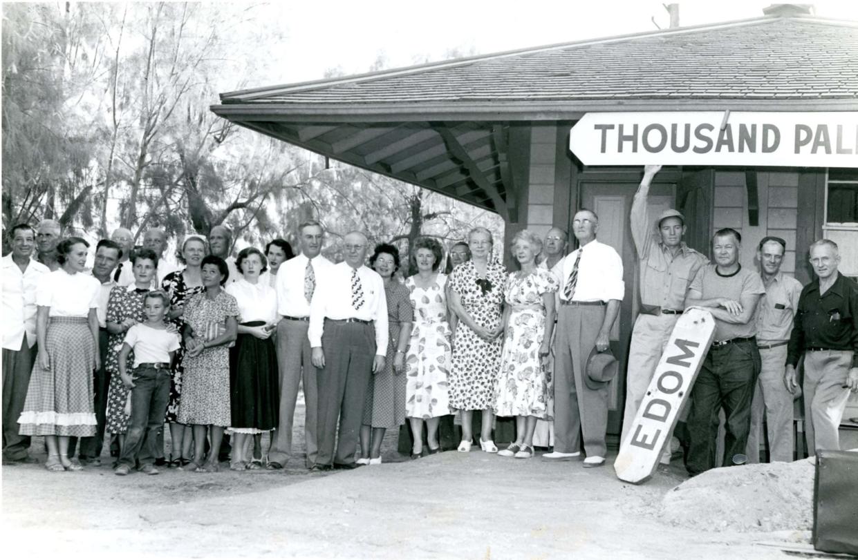 E.C. Willis photograph of the end of Edom; the ceremonial changing of the depot station sign to Thousand Palms. 
