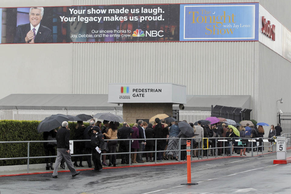 Fans wait outside NBC Studios before the taping of the Tonight Show with Jay Leno Thursday Feb. 6, 2014 in Burbank, Calif. On Thursday, Leno is stepping down for the second and presumably last time, after 22 years. Leno, 63, said he plans to continue playing comedy clubs, indulging his passion for cars and doing such TV work as comes his way, other than hosting on late-night. (AP Photo/Nick Ut)
