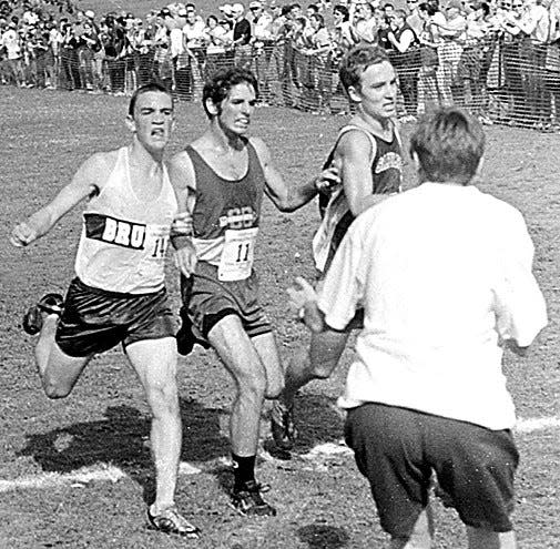 A MOMENT THAT WAS: Bartlesville High's Brett Turowski, left, edges past two valiant challengers during cross country action in the early 2000s.