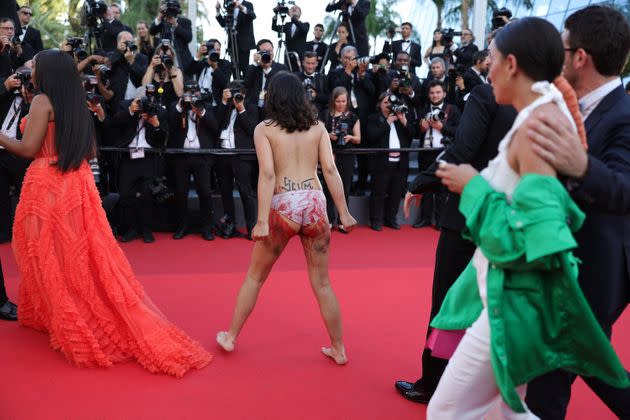 A woman stripped down at the Cannes Film Festival on May 20 to reveal the message 