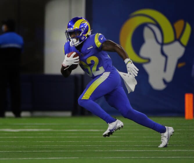 INGLEWOOD, CA - AUGUST 14, 2021: Los Angeles Rams running back Otis Anderson (32) finds some open field against the Chargers at SoFi Stadium on August 14, 2021 in Inglewood, California.(Gina Ferazzi / Los Angeles Times)